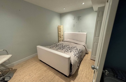 East Village House | close to stampede, private room and bathroom in the basement, a small living