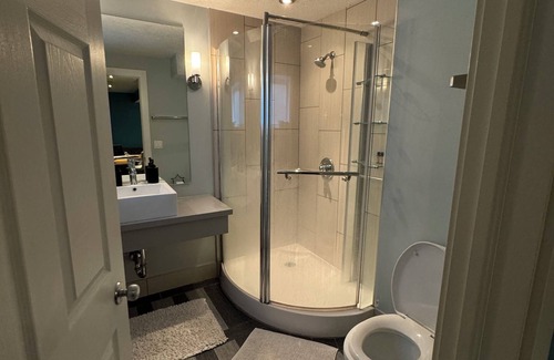 East Village House | close to stampede, private room and bathroom in the basement, a small living