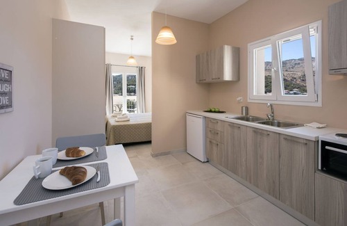 Kassiopi Apartment | Close to the beach, spacious one-bedroom apartment with sea views.