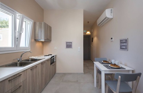 Kassiopi Apartment | Close to the beach, spacious one-bedroom apartment with sea views.