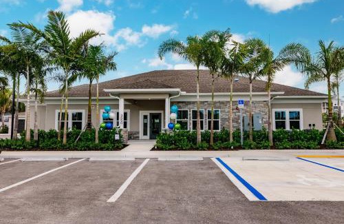 Fort Myers Apartment | Community oasis with pool & gym access
