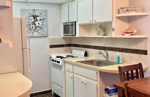 Royal Bahamian Estates Apartment | Coral Beach Retreat. Garden view. Steps from pool & beach. 1 mile to Port Lucaya