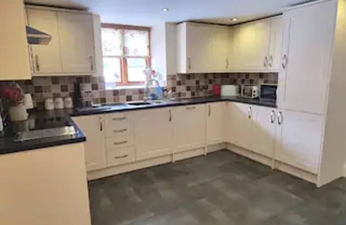 Corwen House | Cosy Barn - Sleeps 8, Hot Tub & Countryside Views