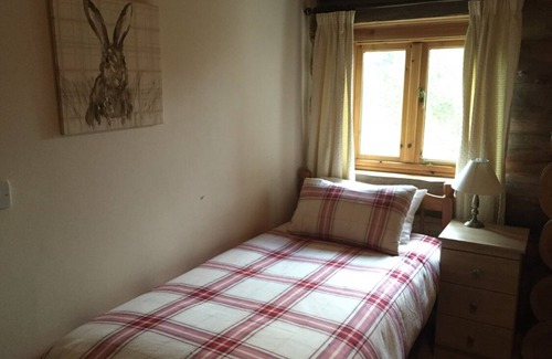 Knockin Cabin | Cosy Log Cabin in rural Shropshire overlooking fishing lakes