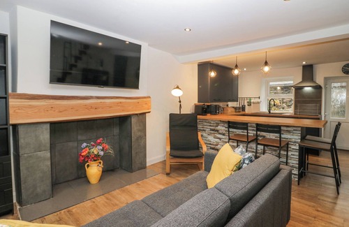 Cark Cottage | COSY LOGS COTTAGE, pet friendly, with a garden in Cark In Cartmel