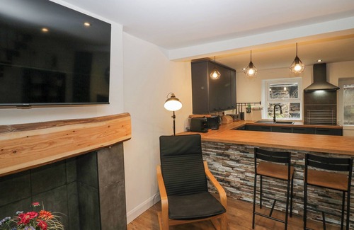 Cark Cottage | COSY LOGS COTTAGE, pet friendly, with a garden in Cark In Cartmel