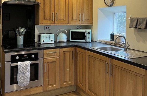 Wing Cottage | Cottage with private hot tub overlooking fishing lake sleeping 4