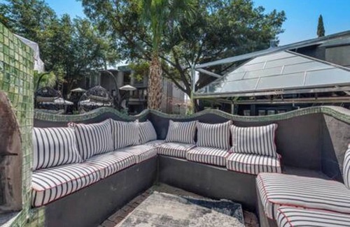 Junius Heights Condo | Cozy 2-story loft with fireplace, luxury linens, full kitchen, and award-winning courtyard.