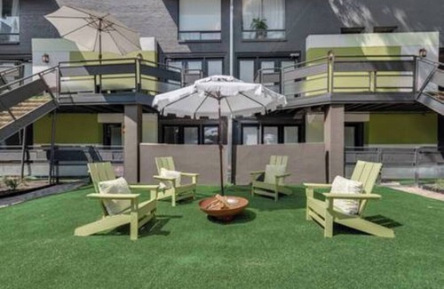 Junius Heights Condo | Cozy 2-story loft with fireplace, luxury linens, full kitchen, and award-winning courtyard.
