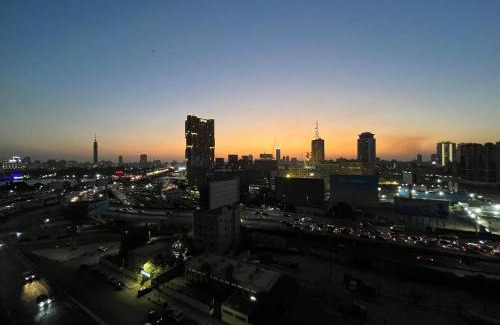 Qasr an-Nil Apartment | Cozy bedroom overlooking downtown & the Nile