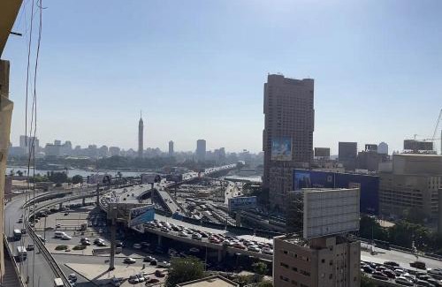 Qasr an-Nil Apartment | Cozy bedroom overlooking downtown & the Nile