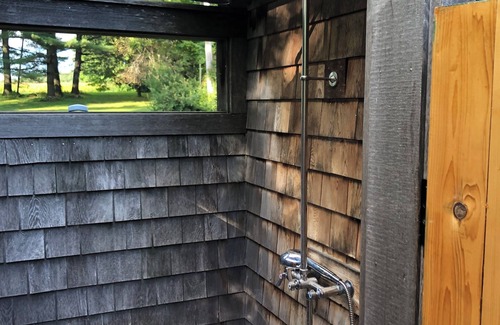 Derby Cabin | Cozy lakeside cabin with AC and WiFi . 240 ft private beach and dock