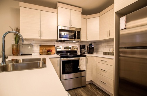 Lethbridge House | Cozy one bedroom suite with a pullout in the living room.