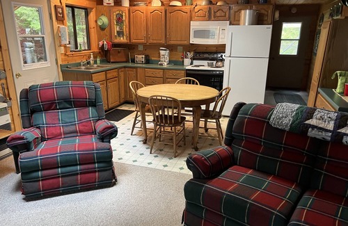 Bowerbank Cottage | Cozy Sebec Lake front cabin with dock and fire pit