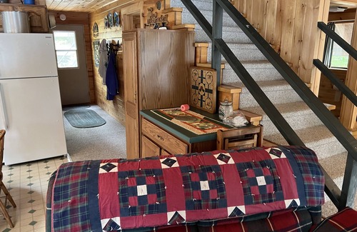 Bowerbank Cottage | Cozy Sebec Lake front cabin with dock and fire pit