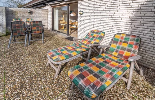 Harlesiel House | Cozy semi-detached house with fireplace and beautiful garden to relax.