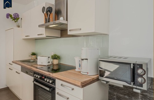 Korswandt Apartment | Cozy vacation apartment in Korswandt on the lake with balcony and lake view