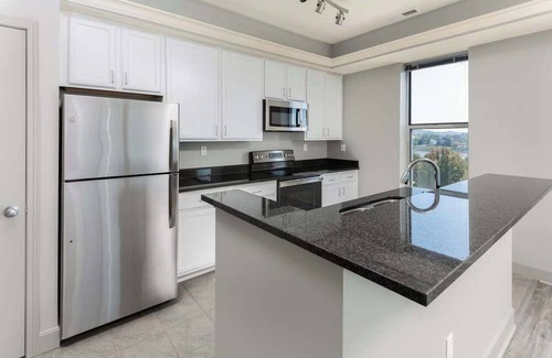 Central Business District Apartment | CozySuites at the Banks gym, pool 02