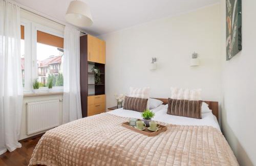 Lagiewniki Apartment | Cracow Verdant Apartment with Parking by Noclegi Renters