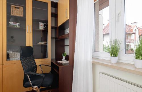 Lagiewniki Apartment | Cracow Verdant Apartment with Parking by Noclegi Renters