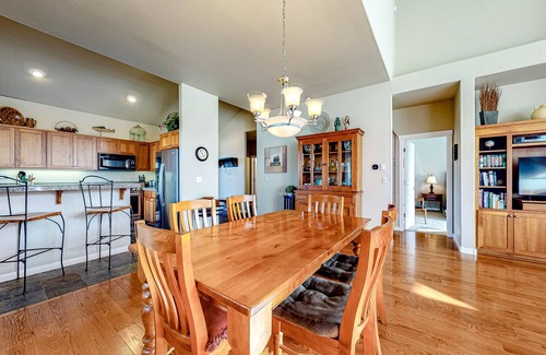 Redmond House | Creekside home with private hot tub & fireplace - access to pools, hot tub, gym