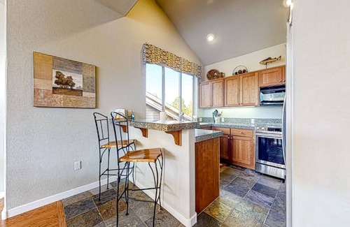 Redmond House | Creekside home with private hot tub & fireplace - access to pools, hot tub, gym