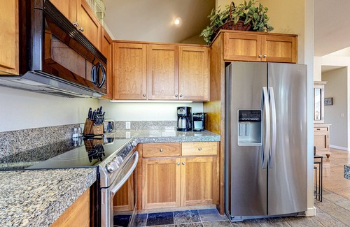 Redmond House | Creekside home with private hot tub & fireplace - access to pools, hot tub, gym