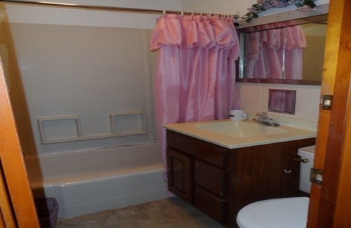 South Butler Cottage | Cute Waterfront Cottage with Large Deck at Turtle Cove Resort