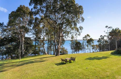 Corlette House | Danalene, 44a Danalene Pde - stunning waterfront property with Air Con, WI-FI, Double Lock Up Garage & Boat Parking