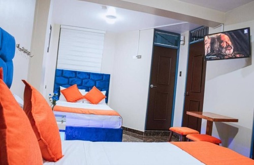 Santiago de Surco Apartment | Deluxe Queen Room with Two Queen Beds 2
