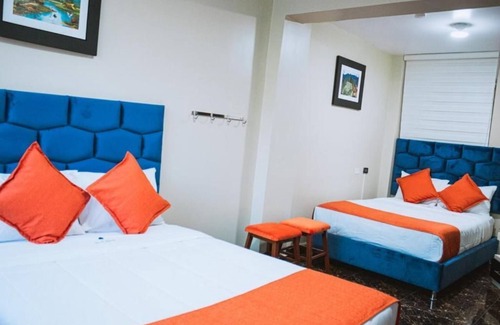 Santiago de Surco Apartment | Deluxe Queen Room with Two Queen Beds 2