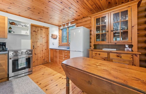 Lion's Head Cabin | Disconnect from it all at Stonewood, a cozy log chalet nestled in cedar forest on Georgian Bay. Enjoy a private shoreline, wraparound deck, wood stove, and access to kayaks, and trails. Peace, comfort, and adventure await in Cape Chin South.