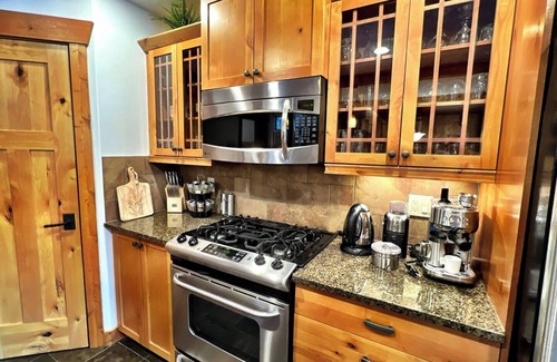 East Kootenay House | Discover mountain serenity at its finest in our stunning home, complete with a soothing hot tub.