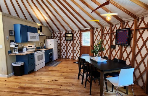 Mill Spring House | Dog friendly 30' Yurt, large dome skylight, king bed, 2 bedrooms, sleeps 6.