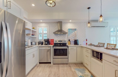 Ocean Isle Beach House | Dog-friendly, 8 minutes to beach with shared pool, covered patio, & big backyard