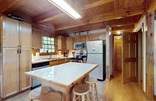 Marshall Cabin | Doolittle mountain cabin with hot tub, firepit & river views | near Asheville