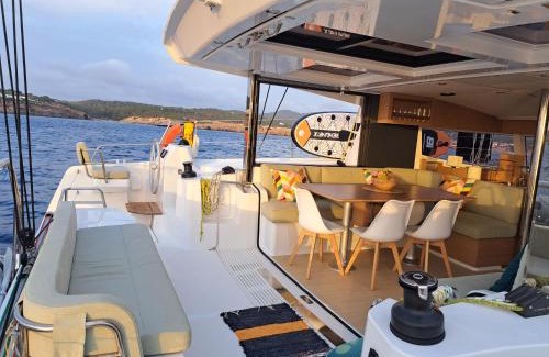 Vallpineda Boat Rental | Dortoka Catamarán