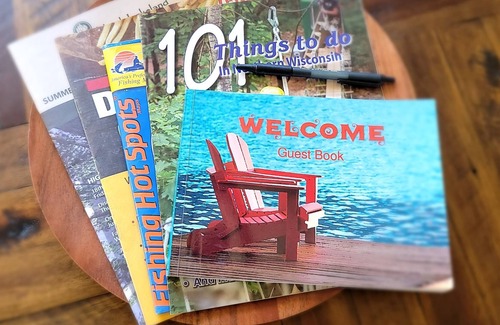 Lake Tomahawk Condo | Eclectic getaway on Lake Tomahawk! Waterfront cabin by trails and downtown LT!