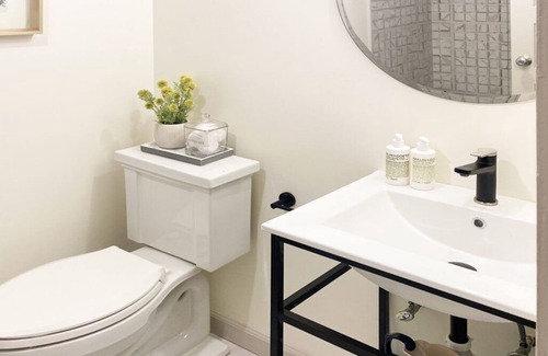 Lenox Bed & Breakfast | Elegant Carriage House room with a queen bed and private patio.