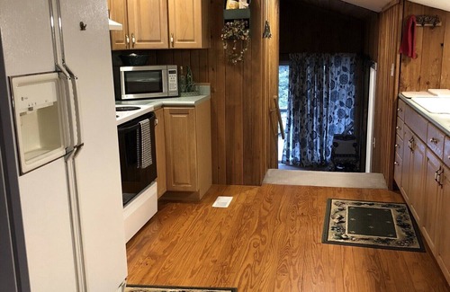 Edmond Cabin | Enjoy our loft with a private hot tub overlooking the vineyard and pond.