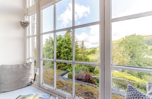 Waterhead Cottage | Enjoy stunning fell views from this grand apartment.