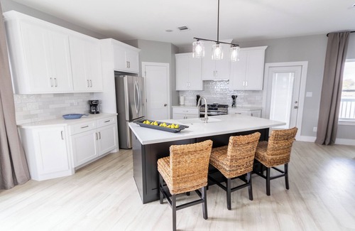 El Lago House | Escape to this serene 3-bedroom bayfront retreat in Seabrook Shores. Featuring stunning water views, a spacious deck for sunsets, and cozy coastal interiors, this hideaway is perfect for family getaways or a peaceful escape by the bay