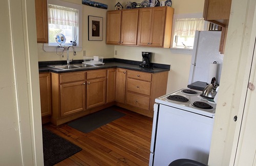 Pond Cove House | Evergreen cottage 5' from the water with private beach.