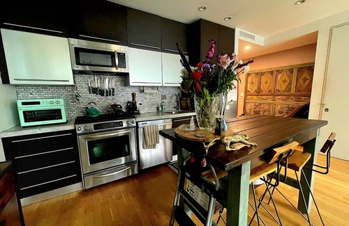 Greenpoint Condo | Experience Luxury by the Water:Private Garden & Unforgettable Views!