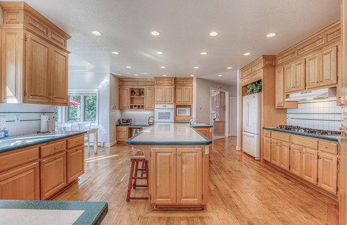 Clinton House | Family friendly water view escape with deck, games and garden views