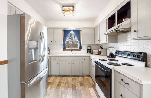 North Central Omaha House | Family-sized home with outdoor pool and deck