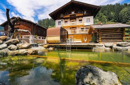 Bramberg am Wildkogel House | Farmhouse in Bramberg with Natural Pond