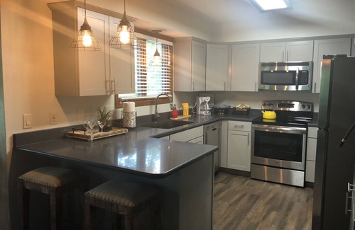 Mount Ida Condo | Forest view, log-sided two bedroom, two bath condo on Lake Ouachita. by RedAwning