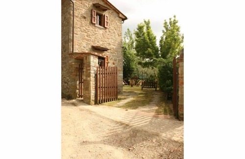 Montecchio Villa | Fully detached and fenced stone farmhouse with an outside porch. Garden equipped with table, chairs,