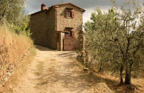 Montecchio Villa | Fully detached and fenced stone farmhouse with an outside porch. Garden equipped with table, chairs,